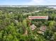 Stunning aerial view of home nestled among lush trees near a lake community at 4563 Osprey Run Ct, Denver, NC 28037