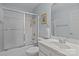 Neat bathroom featuring sink, vanity, mirror, toilet, shower and towel rack with modern fixtures and neutral color scheme at 4563 Osprey Run Ct, Denver, NC 28037