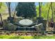 Beautiful stone entrance to Sailview neighborhood with flower garden and small waterfall feature at 4563 Osprey Run Ct, Denver, NC 28037