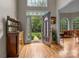 Inviting entryway with hardwood floors and decorative glass door that leads to the rest of the house at 4563 Osprey Run Ct, Denver, NC 28037