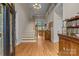 Grand foyer featuring hardwood floors, a staircase, and views into the living spaces at 4563 Osprey Run Ct, Denver, NC 28037