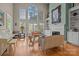 Bright living room with fireplace, hardwood floors, and large windows offering lots of natural light at 4563 Osprey Run Ct, Denver, NC 28037