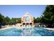 Community pool and clubhouse offers a beautiful spot for residents to gather and relax at 4563 Osprey Run Ct, Denver, NC 28037