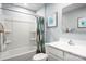 Clean bathroom featuring a shower and tub combination with white tile and a single sink vanity at 5224 Mccallum Meadows Dr, Charlotte, NC 28216