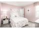 Cozy bedroom with pink walls, plush carpeting, and charming decor at 5224 Mccallum Meadows Dr, Charlotte, NC 28216
