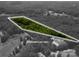 An aerial view of approximate lot lines surrounded by a peaceful wooded setting at 5376 Walter Estate Ln, Iron Station, NC 28080