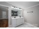 Bathroom with double sink vanity, stylish mirror and updated lighting at 5376 Walter Estate Ln, Iron Station, NC 28080