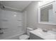 This bathroom features gray walls, white trim, and shower-tub combination at 5376 Walter Estate Ln, Iron Station, NC 28080