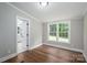 Bright bedroom features wood floors, a large window, and neutral paint at 5376 Walter Estate Ln, Iron Station, NC 28080