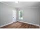 This bedroom boasts wood floors, natural light, and neutral paint at 5376 Walter Estate Ln, Iron Station, NC 28080