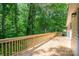 Wood deck with railing in the forest at 5376 Walter Estate Ln, Iron Station, NC 28080