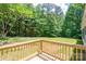 Deck overlooking a lawn and forest at 5376 Walter Estate Ln, Iron Station, NC 28080