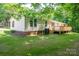 Rear exterior view of home with nice sized deck and yard at 5376 Walter Estate Ln, Iron Station, NC 28080