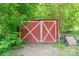 Rustic outdoor shed with white cross pattern on door at 5376 Walter Estate Ln, Iron Station, NC 28080