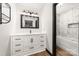Bathroom featuring a white vanity and drawers, a mirror, and a bathtub at 552 Blue Rock Dr, Charlotte, NC 28213