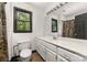 Bathroom featuring a spacious vanity, large mirror, and a convenient toilet at 552 Blue Rock Dr, Charlotte, NC 28213