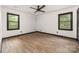 A spacious, bright bedroom featuring hardwood floors, and a ceiling fan for added comfort at 552 Blue Rock Dr, Charlotte, NC 28213