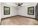 Bright bedroom features two windows and a dark closet at 552 Blue Rock Dr, Charlotte, NC 28213