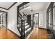 Entryway with refinished staircase and a beautiful, patterned hardwood floor at 552 Blue Rock Dr, Charlotte, NC 28213