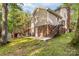 Back view of home and deck and surrounding yard at 552 Blue Rock Dr, Charlotte, NC 28213