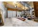 Spacious two car garage with two garage doors, concrete floor, and room for storage at 552 Blue Rock Dr, Charlotte, NC 28213