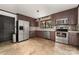 A kitchen area featuring stainless steel appliances and stone backsplash at 552 Blue Rock Dr, Charlotte, NC 28213
