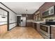A kitchen area featuring stainless steel appliances and stone backsplash at 552 Blue Rock Dr, Charlotte, NC 28213