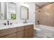 Bathroom showcasing a double vanity, modern fixtures, and stylish tile in the shower area at 554 W Cama St, Charlotte, NC 28217