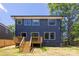 Rear exterior showing the deck, backyard, and windows of the home at 554 W Cama St, Charlotte, NC 28217
