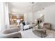 Inviting living room showcasing an open floor plan with hardwood floors, modern furniture, and a view of the adjacent kitchen at 554 W Cama St, Charlotte, NC 28217