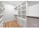 Spacious walk-in closet with custom shelving and drawers, offering ample storage at 554 W Cama St, Charlotte, NC 28217