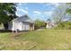 Back exterior of the home showcasing the yard and a modern design at 555 Pryor St, Chester, SC 29706