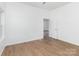 Bright bedroom with wood floors and fresh white walls, a modern and inviting space at 555 Pryor St, Chester, SC 29706