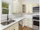 Close-up of the kitchen area showcasing stainless steel appliances, modern countertops, and ample natural light at 555 Pryor St, Chester, SC 29706