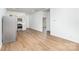 Bright kitchen showcasing stainless steel appliances, white cabinetry, and wood-style floors at 555 Pryor St, Chester, SC 29706