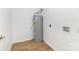 Functional utility room featuring a water heater and hookups for laundry, with clean white walls and flooring at 555 Pryor St, Chester, SC 29706