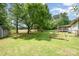 Expansive backyard with lush greenery, a storage shed, and a peaceful ambiance at 604 Chaney Rd, Monroe, NC 28110