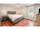 Comfortable bedroom with hardwood floors, soft natural light, and neutral paint for a relaxing retreat at 604 Chaney Rd, Monroe, NC 28110
