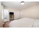 Bright bedroom featuring hardwood floors, a closet, and an ensuite bathroom at 604 Chaney Rd, Monroe, NC 28110