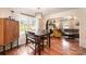 Cozy dining area with hardwood floors, natural light, and a view into the inviting living room at 604 Chaney Rd, Monroe, NC 28110