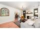 Open-concept living room showcasing hardwood floors, fireplace, and a seamless flow into the dining area at 604 Chaney Rd, Monroe, NC 28110