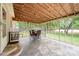 Relaxing screened porch with a dining set and views of the expansive backyard at 604 Chaney Rd, Monroe, NC 28110