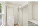 A spacious walk-in closet with custom built-in shelving, drawers, and hanging rods at 611 Heathermoor Ct, Charlotte, NC 28209