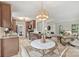 Open concept kitchen featuring wood cabinets, stainless appliances, and a charming breakfast nook, perfect for Gathering gatherings at 611 Heathermoor Ct, Charlotte, NC 28209