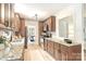 This kitchen features wood cabinetry, granite countertops, and stainless steel appliances, offering modern convenience and style at 611 Heathermoor Ct, Charlotte, NC 28209