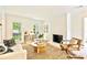 Inviting living room with a cozy fireplace, neutral decor, and lots of natural light at 611 Heathermoor Ct, Charlotte, NC 28209