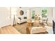Bright living room featuring an area rug, neutral decor, and an inviting seating arrangement at 611 Heathermoor Ct, Charlotte, NC 28209