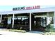 Exterior of Burton's Grill & Bar with outdoor seating, large windows, and visible signage at 611 Heathermoor Ct, Charlotte, NC 28209