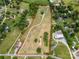 Expansive property featuring a large home, open land, and surrounding greenery, all within a defined boundary at 6218 Indian Trail Fairview Rd, Indian Trail, NC 28079