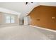 Spacious carpeted bedroom featuring a window, high ceilings, and neutral tones for a cozy atmosphere at 6218 Indian Trail Fairview Rd, Indian Trail, NC 28079